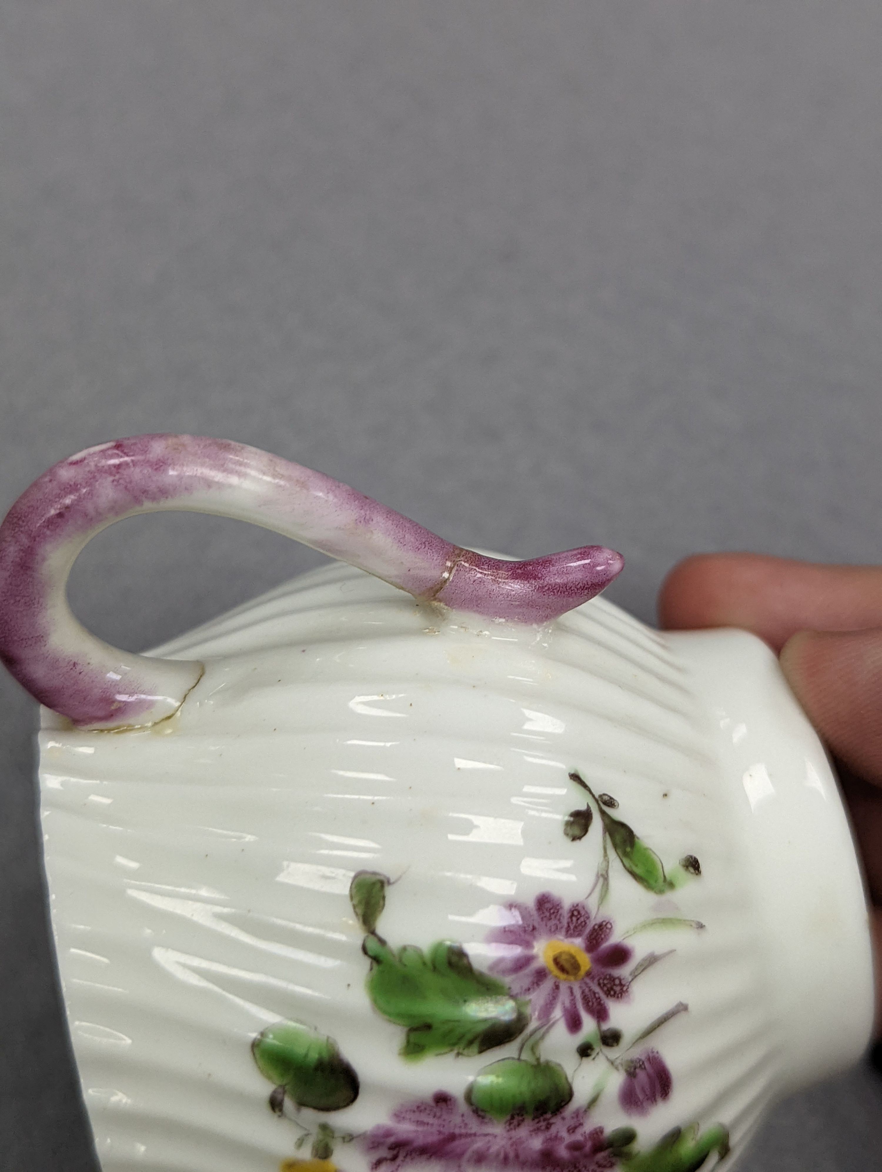 An 18th century Mennecy porcelain cup and cover, a Meissen style cup and cover, an English porcelain floral encrusted double inkwell and cover and a similar jar and cover